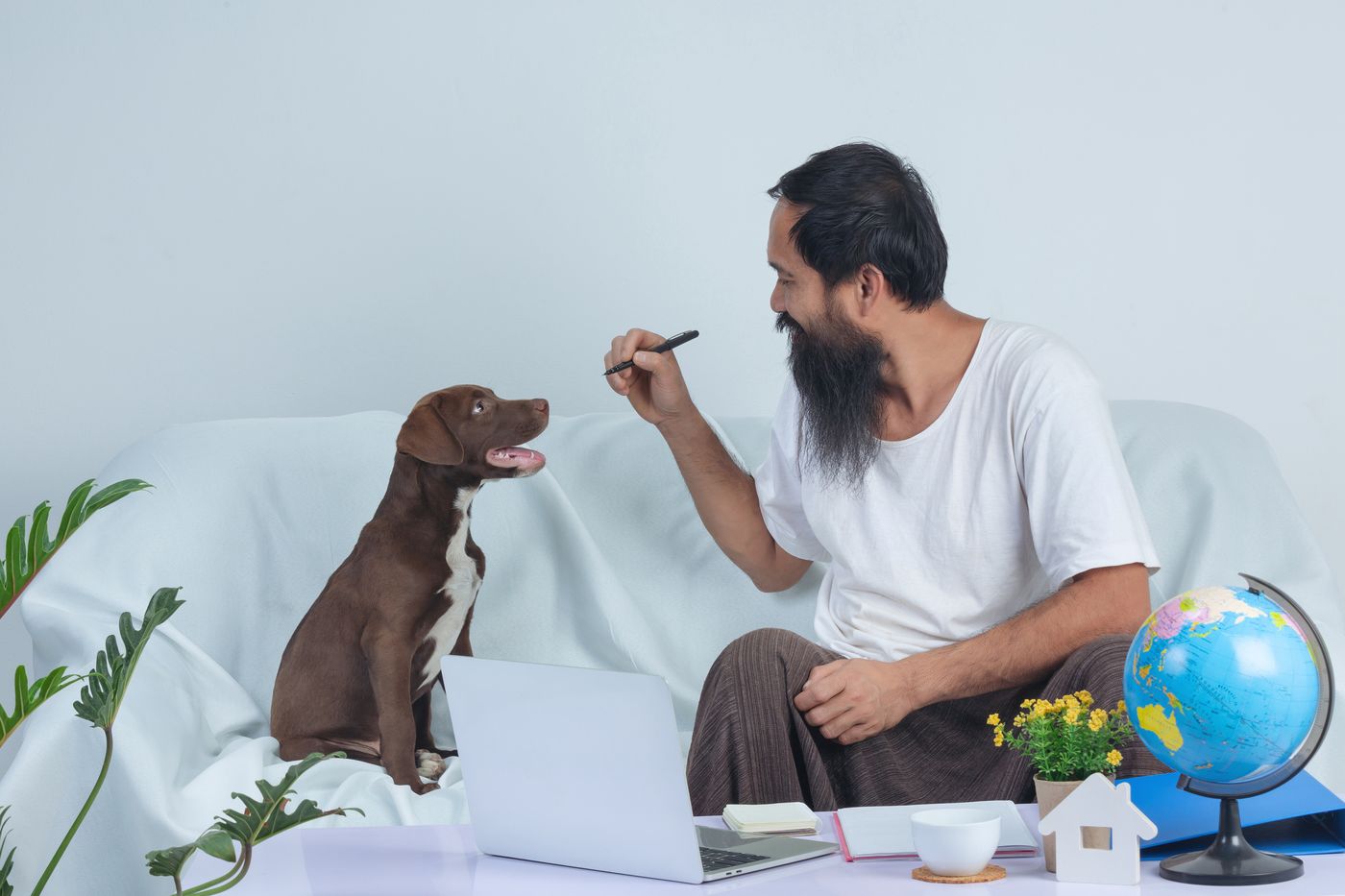 Man at home on the sofa with his pet